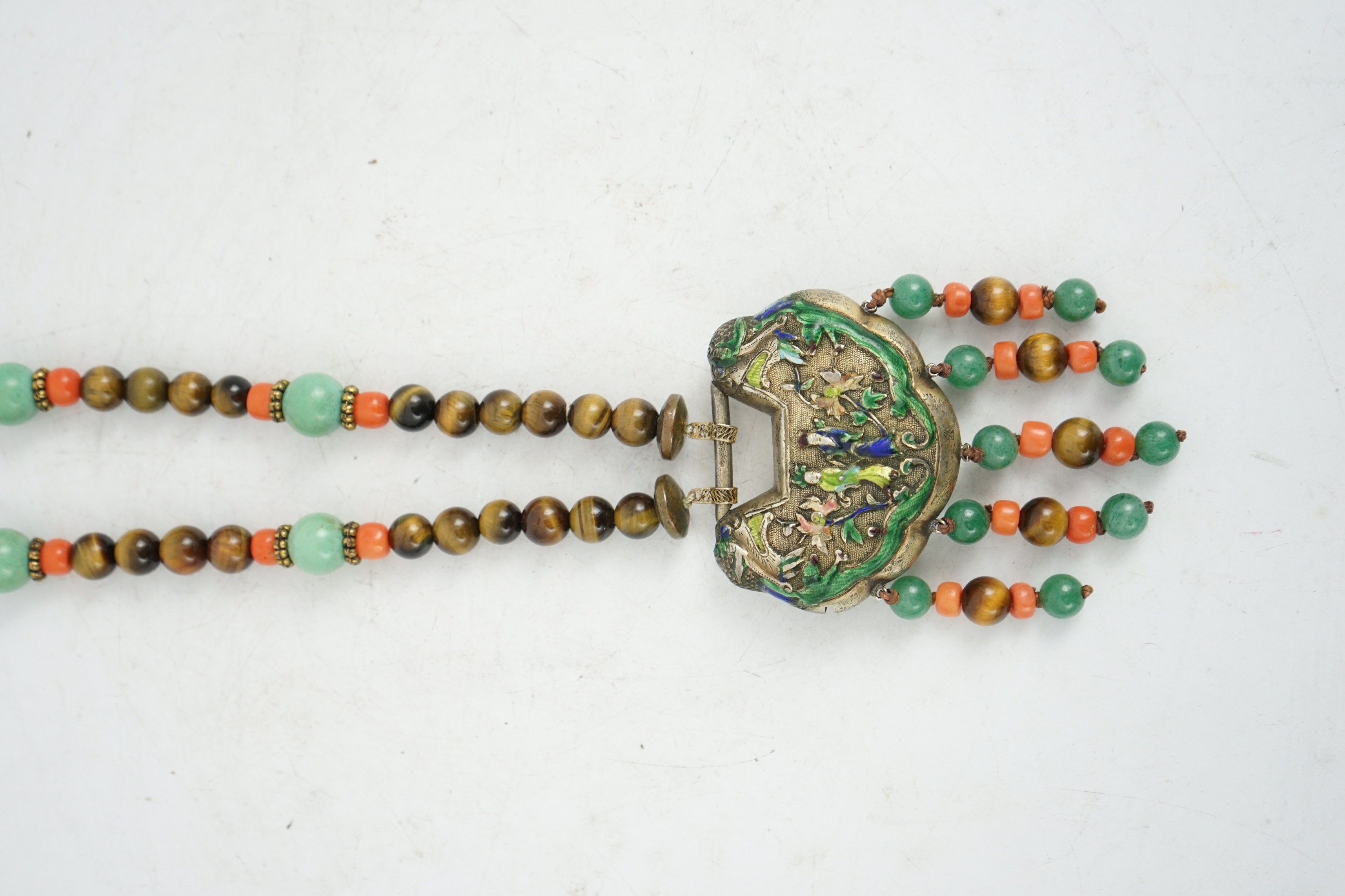 A Chinese silver and enamel amulet tiger's eye, coral and turquoise bead necklace, housed in a liberty box. Condition - good